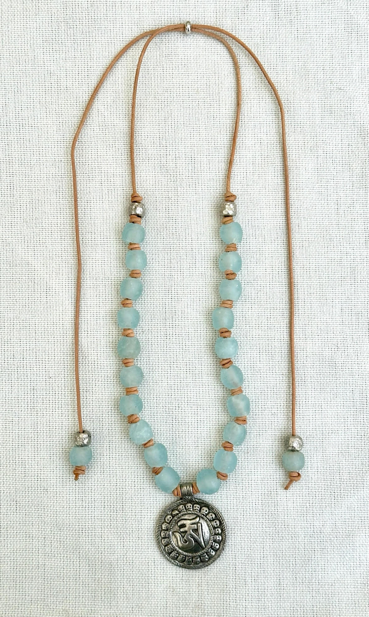 Blue Glass Beaded Necklace with round OM pendant