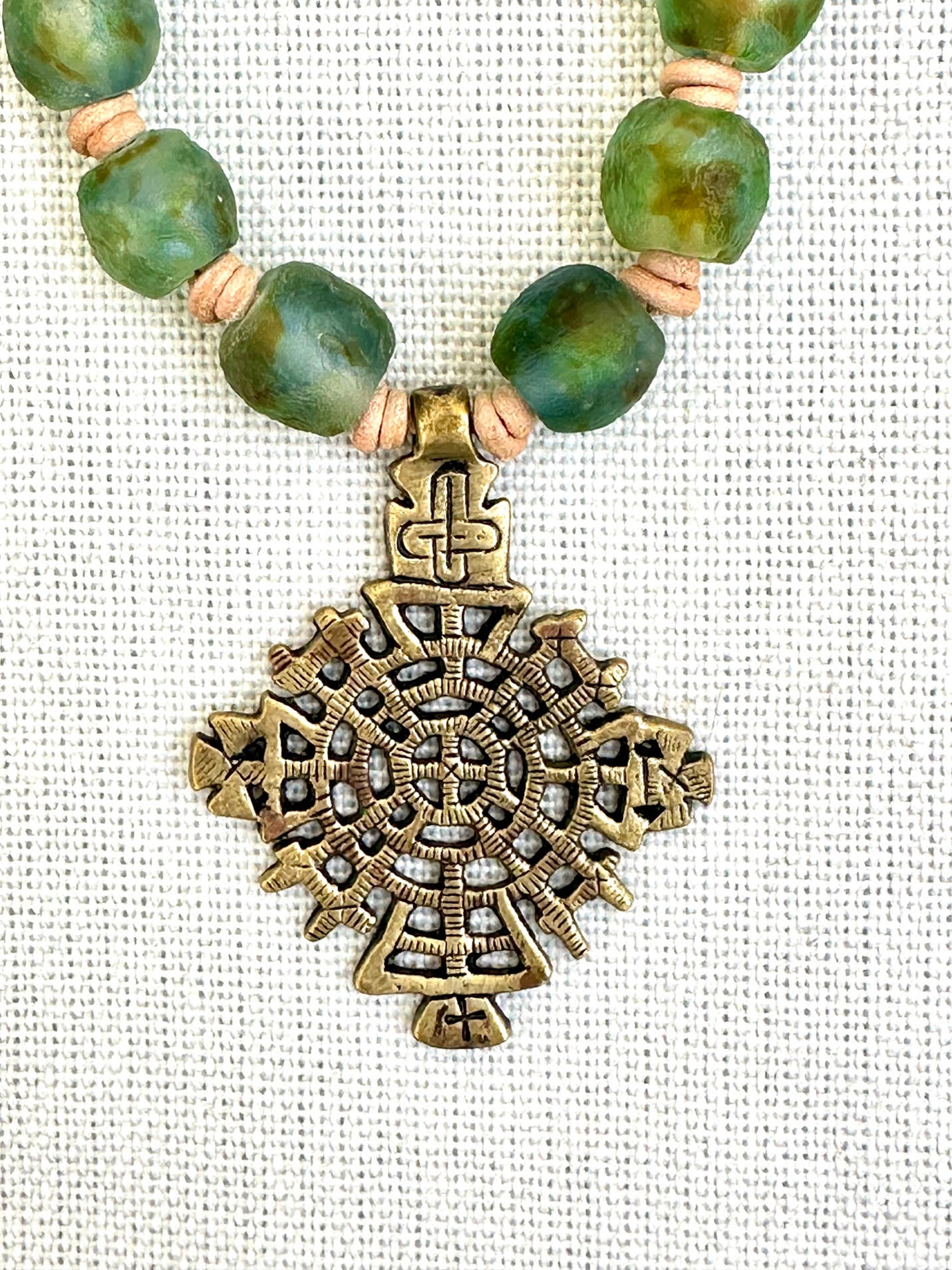 Variegated Blue, Green, Brown Glass Beaded Necklace with Ethiopian Brass Cross Pendant